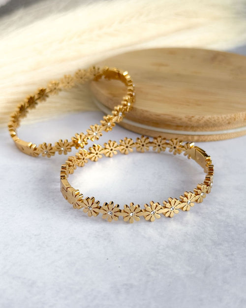 Gold bracelet with floral designs